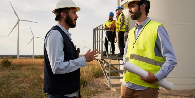 Engineers beside Wind Turbine