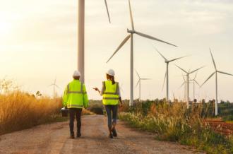 Maintenance technician team working in wind turbine farm
